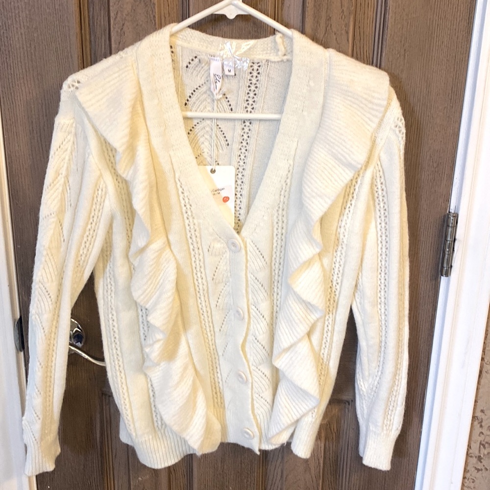 Off-white boutique, cardigan, size medium.